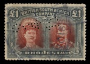 Rhodesia: 1910-13 (SG.179) perf.15 "Double Head" &pound;1 Red & Black, with oval fiscal cancellation; additionally with perfin&nbsp;"9-4-19".