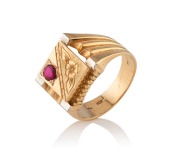 A Kuwaiti&nbsp;18ct gold signet ring, set with a cut ruby, 14.2 grams