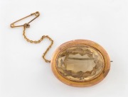 An antique 9ct gold mounted citrine brooch, 19th/20th century, stamped "9ct", 3cm wide, 10.2 grams total.