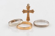 Two 18ct white gold wedding bands (4.2 grams), a 9ct yellow gold wedding band and a cross pendant (2.7 grams), (4 items), 6.9 grams total
