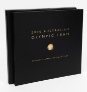 2000 Australian Olympic Team Official Celebration Collection large format book, with a $100 GOLD proof "Achievement" and 10 x $5 bronze "Gold Medal Sports" coins. Issued by the Perth Mint . This is set No. 0136 of 2000. With statements by the leading Olym