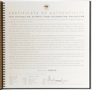2000 Australian Olympic Team Official Celebration Collection large format book, with a $100 GOLD proof "Achievement" and 10 x $5 bronze "Gold Medal Sports" coins. Issued by the Perth Mint . This is set No. 0136 of 2000. With statements by the leading Olym - 3