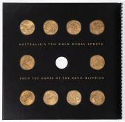 2000 Australian Olympic Team Official Celebration Collection large format book, with a $100 GOLD proof "Achievement" and 10 x $5 bronze "Gold Medal Sports" coins. Issued by the Perth Mint . This is set No. 0137 of 2000. With statements by the leading Olym - 2