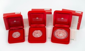 2000 YEAR OF THE DRAGON: AUSTRALIAN LUNAR SILVER COIN PROOF SERIES of three coins, comprising of the $2 (2oz), the $1 (1oz) and the 50c (½oz), all depicting a dragon gazing at a pearl; each in their original felt-lined red case of issue and accompanied by a Certificate of Authenticity. (3 coins)