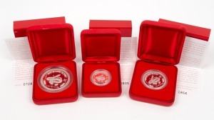 2001 YEAR OF THE SNAKE: AUSTRALIAN LUNAR SILVER COIN PROOF SERIES of three coins, comprising of the $2 (2oz), the $1 (1oz) and the 50c (½oz), all depicting a snake; each in their original felt-lined red case of issue and accompanied by a Certificate of Authenticity. (3 coins)