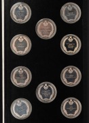 THE HISTORY OF MAN IN FLIGHT: a set of 50 silver medallions, each depicting an event in aviation history. Housed in presentation album, together with a separate album housing the text. Both albums in a slipcase. Produced by The Royal Airforce Museum, 1973 - 2