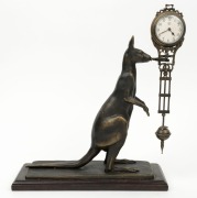 A reproduction Mystery "Kangaroo" swinging clock, 29cm high