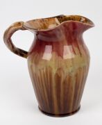 REMUED&nbsp;large pink and brown pottery jug with branch handle (A/F), together with a REMUED ashtray, vase, jug and basket vase, (5 items), the largest 25cm high - 4