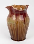REMUED&nbsp;large pink and brown pottery jug with branch handle (A/F), together with a REMUED ashtray, vase, jug and basket vase, (5 items), the largest 25cm high - 5