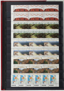 Large red Lighthouse hingeless album housing a decimal period collection in blocks and strips, with values to $2. (100s) MUH. FV: $850+. - 2