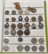 AN ACCUMULATION OF ASSORTED COINS, MEDALLIONS AND BADGES: Housed in a green album with a quantity loose. Of note: 1966 Australian 50 cents pieces, 1927 Australian Floren, decimal and pre-decimal Australian coins, coins of the world, numerous pennies etc. - 2