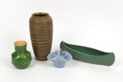 A green glazed pottery vase incised "H. King", together with a blue basket vase, a green canoe vase, and a Japanese art pottery vase with banded decoration, (4 items), the largest 25cm high