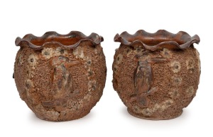 A pair of Australian earthenware salt glazed jardinieres with ruffled rims, sgraffito textured ground and applied kookaburras and flower heads, circa 1920, 26cm high, 26cm diameter