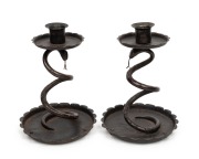 A pair of antique German blackened steel snake candlesticks, stamped "Hoffman 23, Germany", 18cm high
