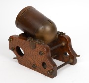 An antique novelty desk timepiece in the form of a mortar cannon, polished oak carriage with brass fittings, the cannon barrel with remnants of original gilt finish and English diamond registration mark, time only movement, lever escapement and silvered d - 2
