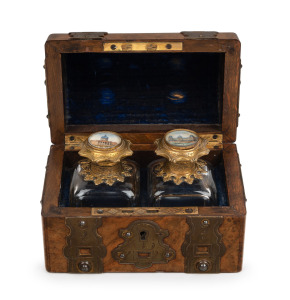 GRAND TOUR pair of antique French scent bottles with gilt metal mounts and hand-painted architectural vignettes to the tops, attractively housed in a walnut dome topped casket with ornate gilt metal mounts and hinges, circa 1850, 10cm high, 14cm wide, 9cm deep