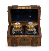 GRAND TOUR pair of antique French scent bottles with gilt metal mounts and hand-painted architectural vignettes to the tops, attractively housed in a walnut dome topped casket with ornate gilt metal mounts and hinges, circa 1850, 10cm high, 14cm wide, 9cm