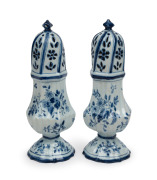 A pair of antique Delft earthenware spice jars with baluster shaped bodies with pierced dome tops, 18th/19th century, 21.5cm high.