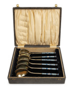 A boxed set of six Russian silver soup spoons, all handsomely adorned with enamel decoration, 19th/20th century, (marks difficult to decipher), ​​​​​​​18.5cm long, 304 grams total