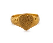 An antique Chinese 22ct gold ring with central heart shaped decoration&nbsp;with character for "Blessing" flanked by cherry blossoms, stamped with character marks to the inside, 19th century, 5.7 grams.