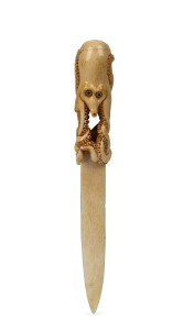 An antique Japanese carved whale bone paper knife with octopus decoration, Meiji Period, 19th/20th century, 23cm high
