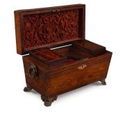 A Regency sarcophagus form tea caddy, strikingly veneered in kingwood with pressed and gilt brass paw feet and handle, interior fitted with two lidded compartments and original ruffled velvet lining, circa 1835, 20cm high, 32cm wide, 16cm deep. - 2