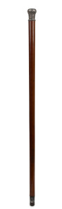 An antique walking stick with ornate silver handle inset with New Zealand greenstone, on a Malacca cane shaft with metal ferrule, 19th century, 90cm long.