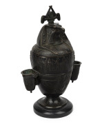 An Egyptian revival bronze table cigar holder, early to mid 19th century, 29cm high