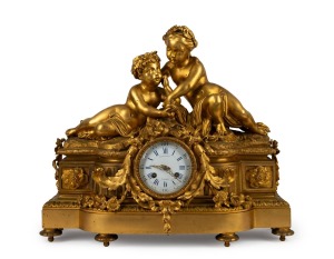 An antique gilt bronze figural cased French mantle clock with eight day time and bell striking movement with Roman numerals, 19th century, 42cm high.