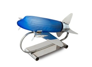 Art Deco&nbsp;style chrome and blue glass&nbsp;aeroplane lamp, 20th century, glass stamped "SARSAPARILLA DECO DESIGNS PAT. PENDING, N.Y.C. N.Y.", ​​​​​​​20cm high, 29.5cm long.