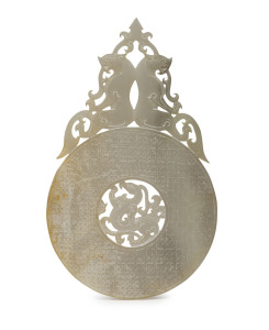A Chinese carved mutton jade bi-disc adorned with mythical creatures, Tang Dynasty, 23.5cm high