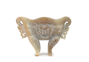 An antique Chinese carved jade vessel in the Archaic style with Taotie mask, late Song/Ming Dynasty, (960-1644), 11cm high