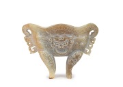 An antique Chinese carved jade vessel in the Archaic style with Taotie mask, late Song/Ming Dynasty, (960-1644), 11cm high