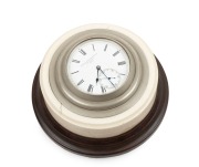 MINOAH BRODES & SON of Bradford antique English desk clock in ivory mount on a timber plinth, 19th century, 10cm diameter overall.