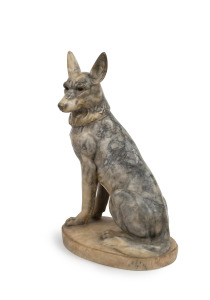 An antique Continental carved alabaster statue of a sitting German shepherd, early 20th century, 42cm high.