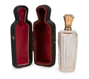 An antique French cut crystal scent bottle with 15ct gold top, original stopper plus leather and silk lined case, 19th century, the bottle 9cm high overall.