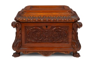 An antique English work box with ornately carved decoration, West Indian satinwood and mahogany, interior fitted with lift-out tray and compartments, with further applied and carved decoration inside the lid. A very handsome example. 19th century. 19cm high, 28cm wide, 20cm deep.