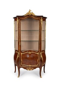 An impressive antique French palisander serpentine front vitrine with Rococo ormolu mounts and brass beading, 19th century, 187cm high, 108cm wide, 52cm deep.