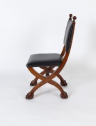 An antique Queensland maple and black leather cross framed hall chair with carved lion paw feet, 19th/20th century, 94cm high - 2