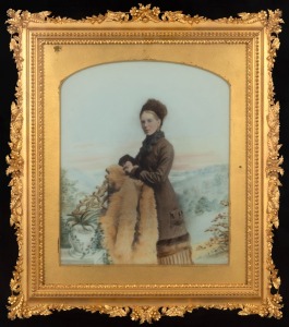 An antique hand-coloured photo portrait of a lady, housed in a period frame with ornate gilt decorated mount, 19th century, 49 x 44cm overall.