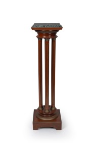 An antique French Empire style mahogany pedestal with four brass inset fluted columns, brass capitals and green variegated marble top, circa 1900, 115cm high, 31cm wide, 31cm deep