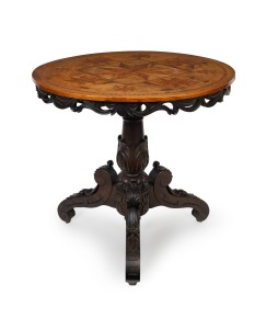 An antique Italian circular occasional table with starburst parquetry top and ornately carved base, 19th century, 75cm high, 80cm diameter