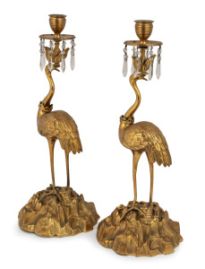 A pair of antique French gilt bronze candlesticks with crane bases, 19th century, 37cm high.