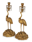 A pair of antique French gilt bronze candlesticks with crane bases, 19th century, 37cm high.
