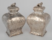 A pair of antique Dutch silver tea caddies with repousse decoration and lion finials, 19th century, 14cm high, 418 grams. - 2