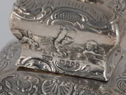 A pair of antique Dutch silver tea caddies with repousse decoration and lion finials, 19th century, 14cm high, 418 grams. - 3