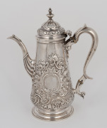 A Georgian sterling silver coffee pot with ornate floral repousse decoration and engraved rampant lion family crest, marks rubbed, 23cm high, 693 grams - 2
