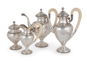 An antique four piece Italian 800 silver tea and coffee service, handsomely adorned with eagle head spouts and ivory handles, early 20th century, the largest 28cm high, 2,550 grams total including handles