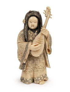 A Japanese carved ivory statue of a musician, early to mid 20th century, 15.5cm high