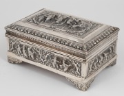 A Burmese silver casket ornately adorned with repousse figural decoration on all sides, interior lined in rainforest hardwood, 8cm high, 15cm wide, 10cm deep, 612 grams total (including timber lining) - 2